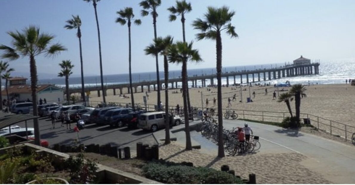The Manhattan Beach strand lined with palms