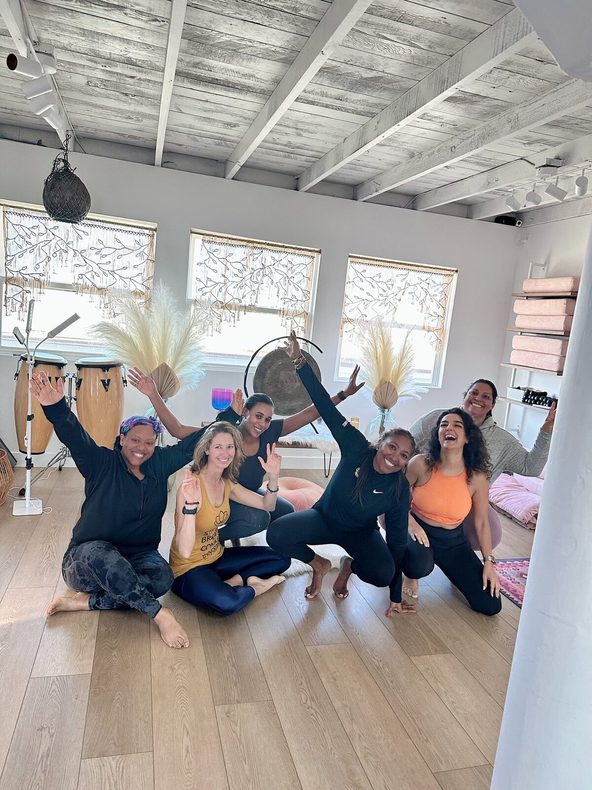 A joyful group of women celebrating together in the studio